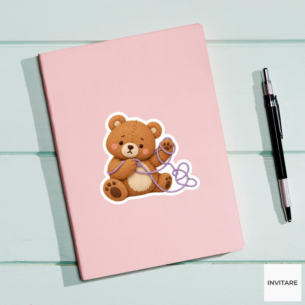 Bear trying to unravel a loop of thread from its paw Vinyl Sticker