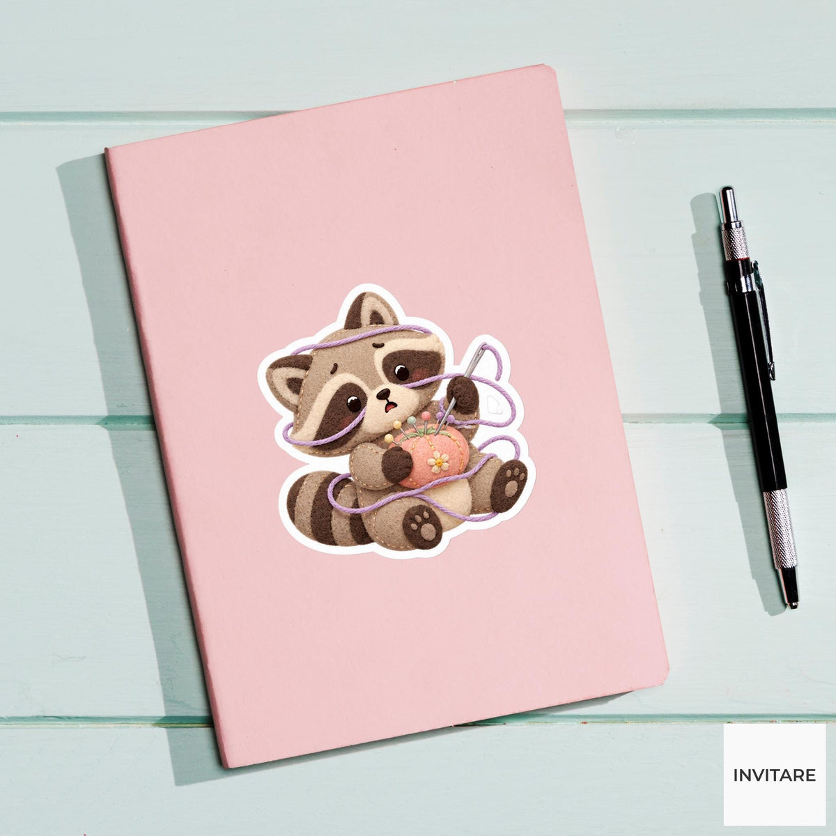 Raccoon caught in a soft thread loop while holding a needle cushion Vinyl Sticker