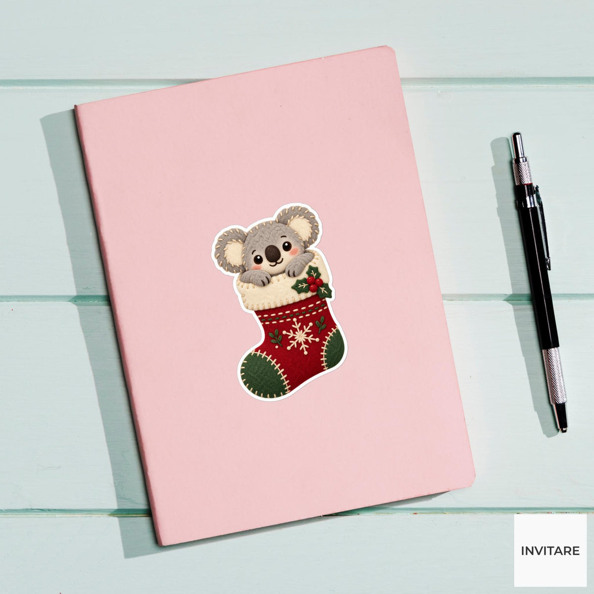 Koala hugging the top of a stocking while its round body stays tucked inside Vinyl Sticker