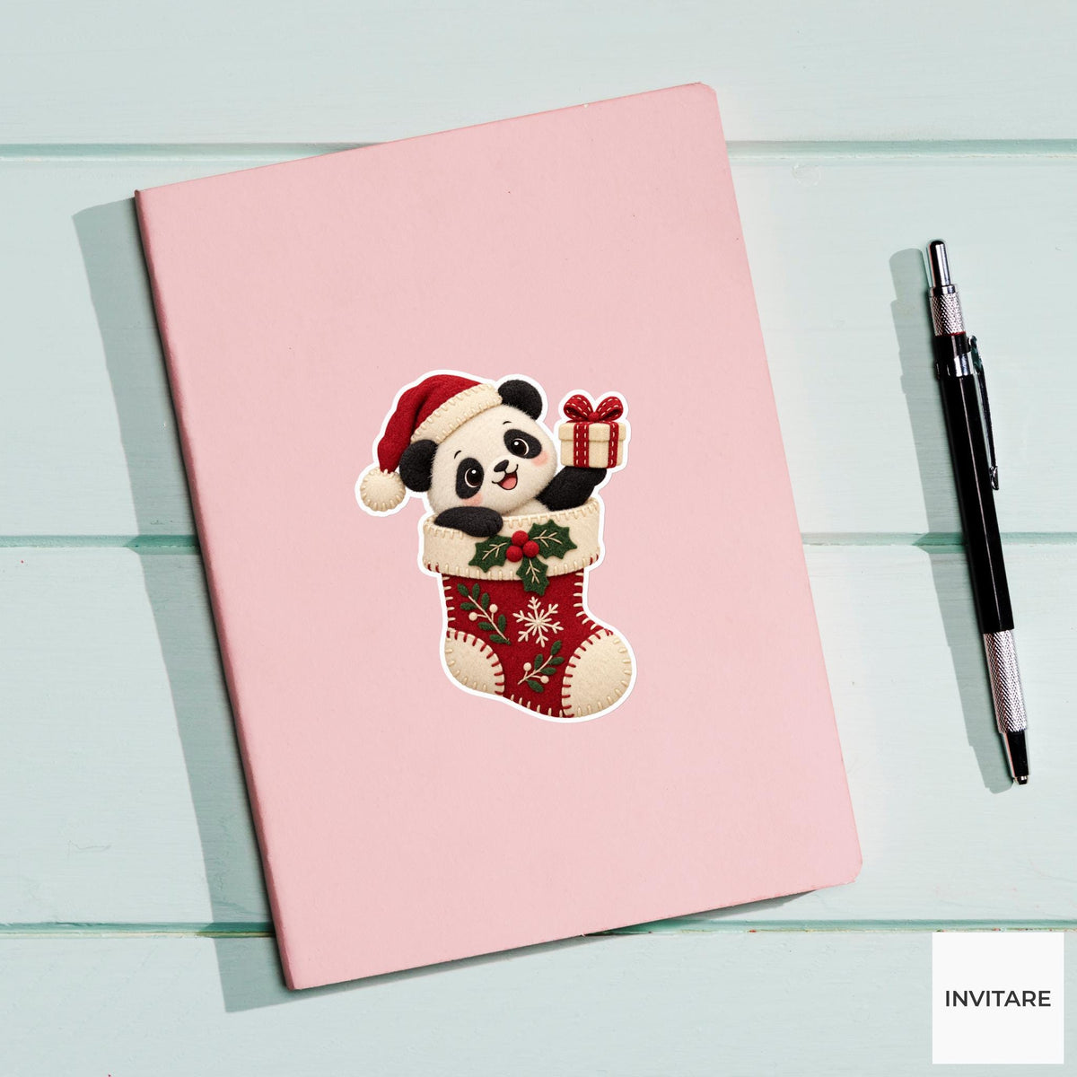 Panda popping out of a stocking and presenting a tiny cream gift box Vinyl Sticker