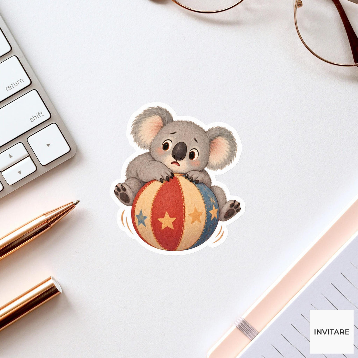 Koala sitting on a rolling ball with paws gripping tightly Vinyl Sticker