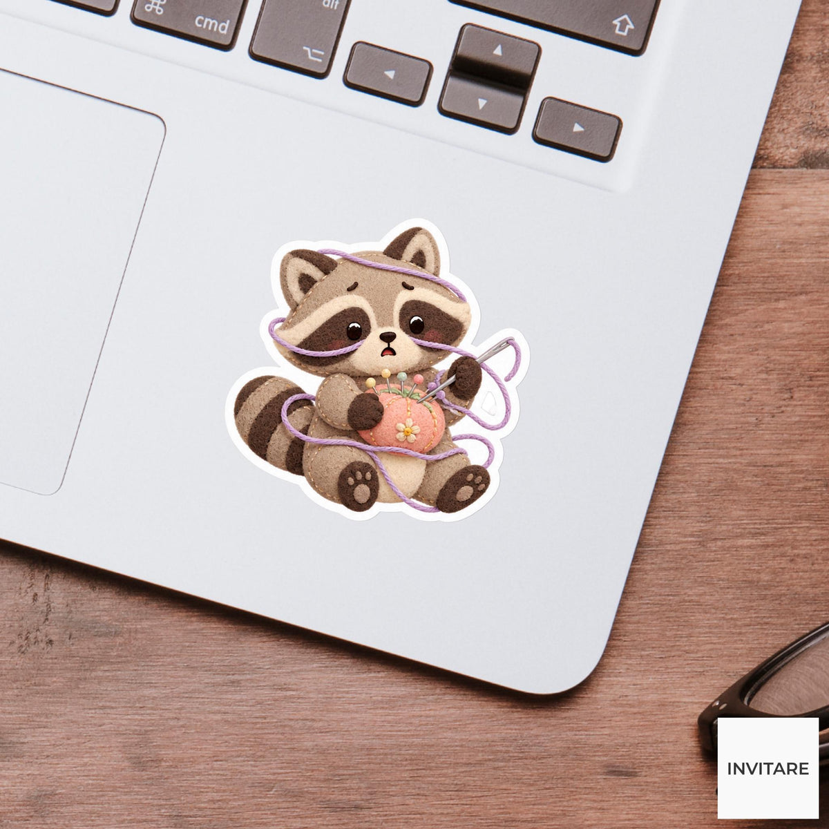 Raccoon caught in a soft thread loop while holding a needle cushion Vinyl Sticker
