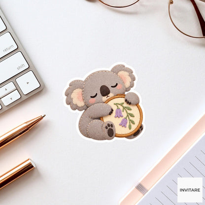 Koala hugging a fabric hoop while slowly falling asleep Vinyl Sticker