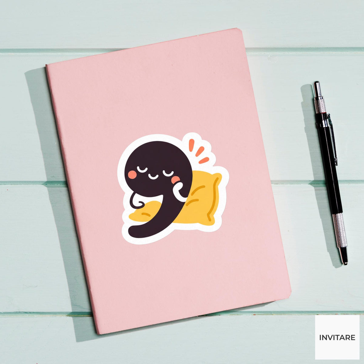 comma leaning on a tiny cushion Vinyl Sticker
