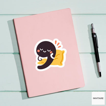comma leaning on a tiny cushion Vinyl Sticker