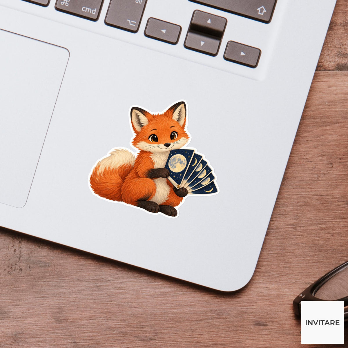 Fox holding a moon-phase flipbook with one page open like a fan Vinyl Sticker