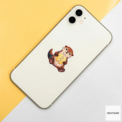 Otter holding two puzzle halves against its belly like a nearly finished moon Vinyl Sticker