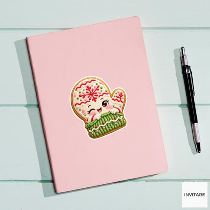 Mitten cookie pulling on a chunky green icing cuff with both tiny hands Vinyl Sticker