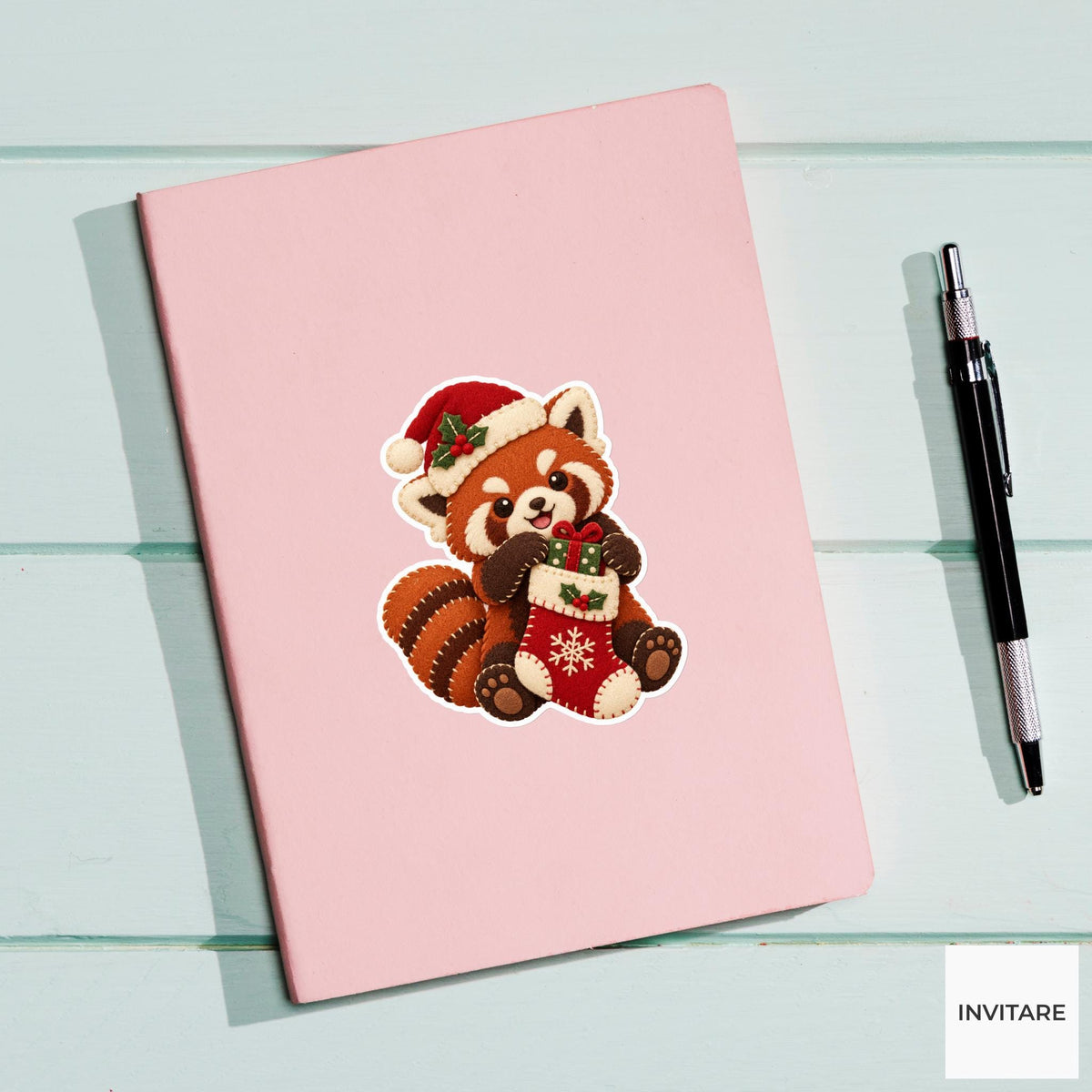 Red panda pulling a tiny wrapped gift out of its stocking with both paws Vinyl Sticker