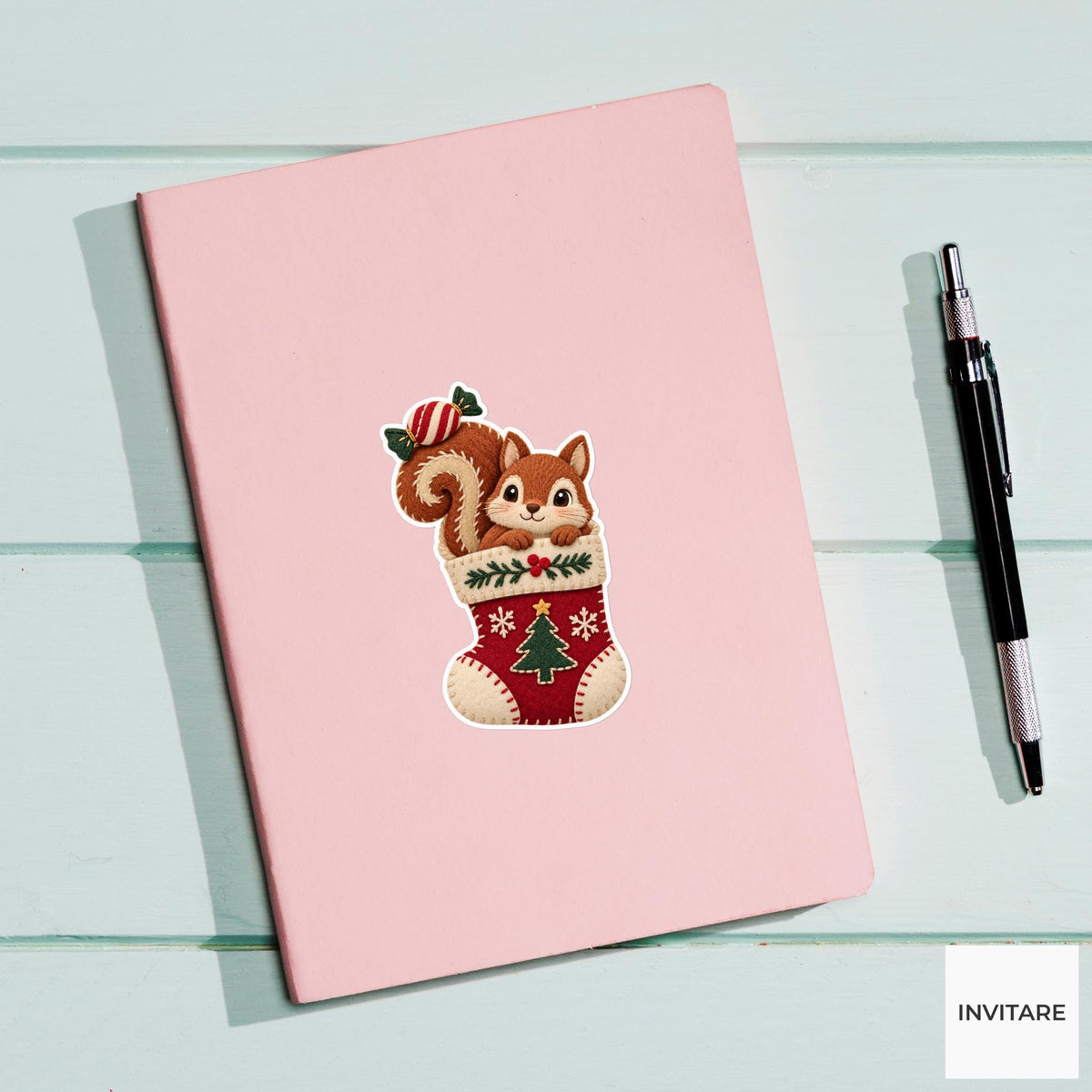 Squirrel hiding in a stocking with a wrapped sweet balanced on its curled tail Vinyl Sticker