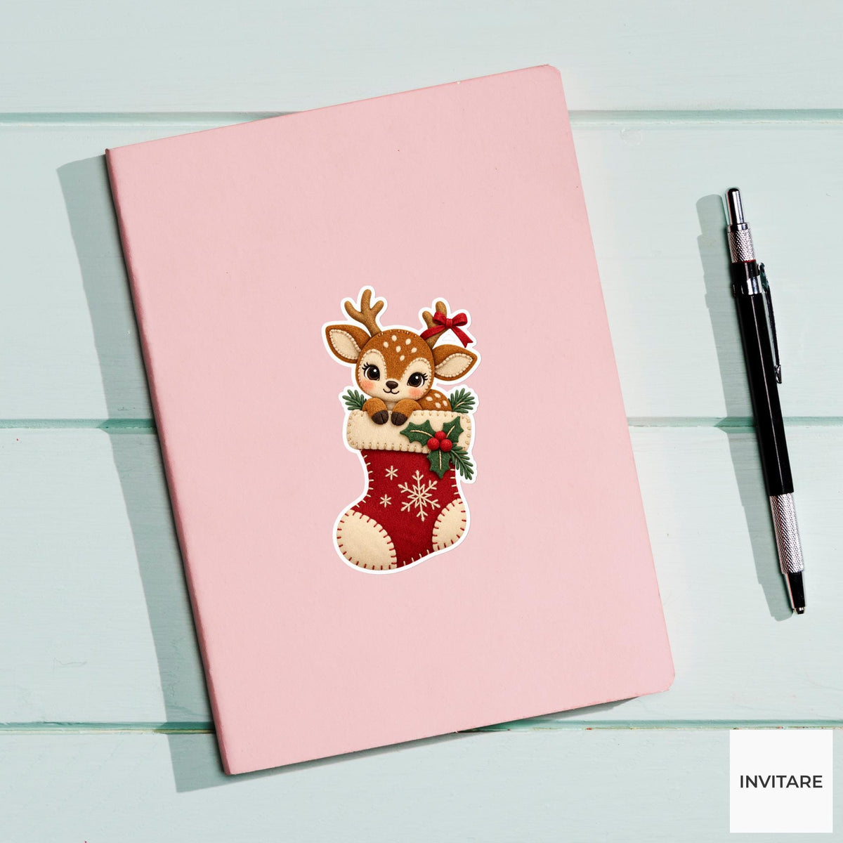 Deer peering out of a stocking with a tiny gift ribbon caught on one small antler Vinyl Sticker