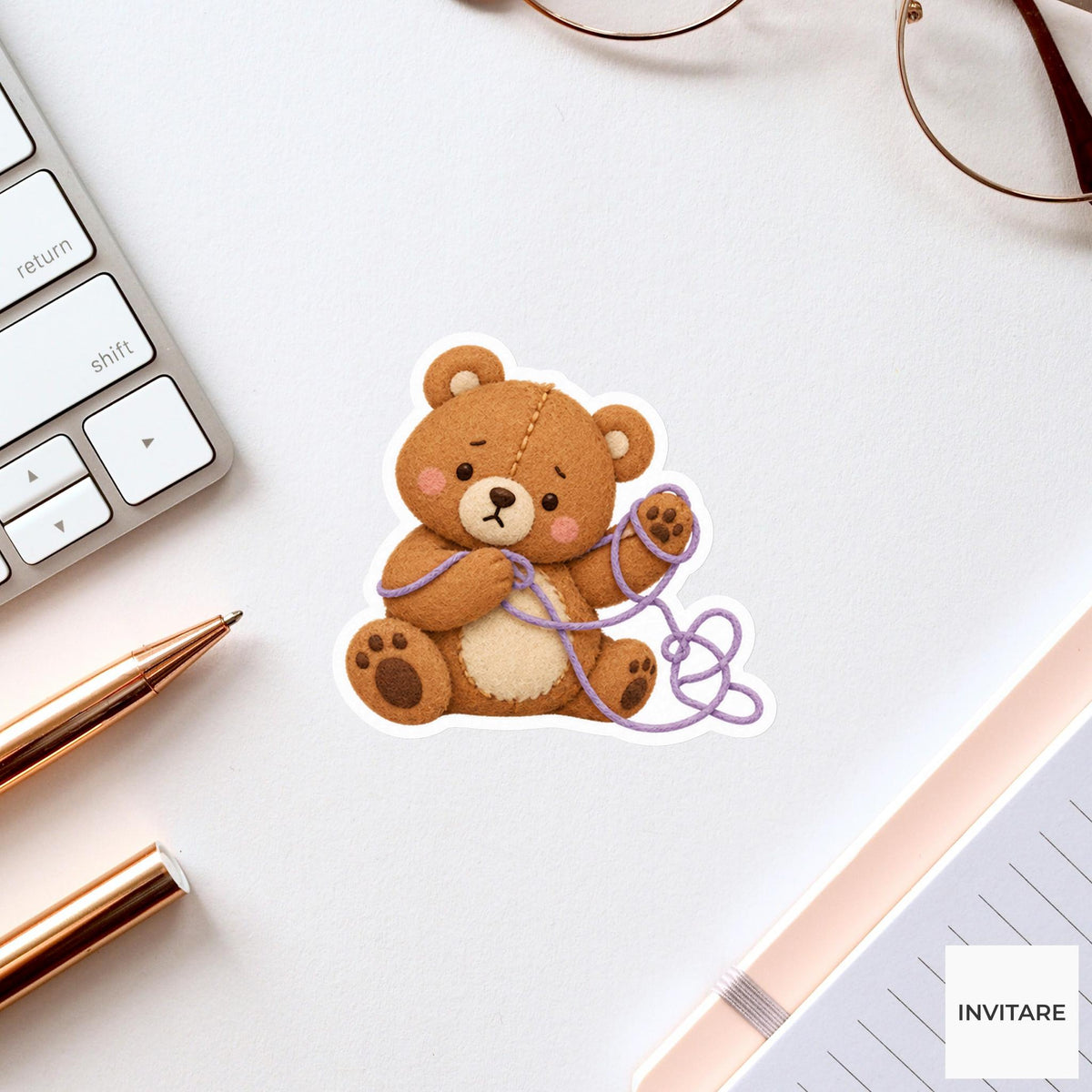 Bear trying to unravel a loop of thread from its paw Vinyl Sticker