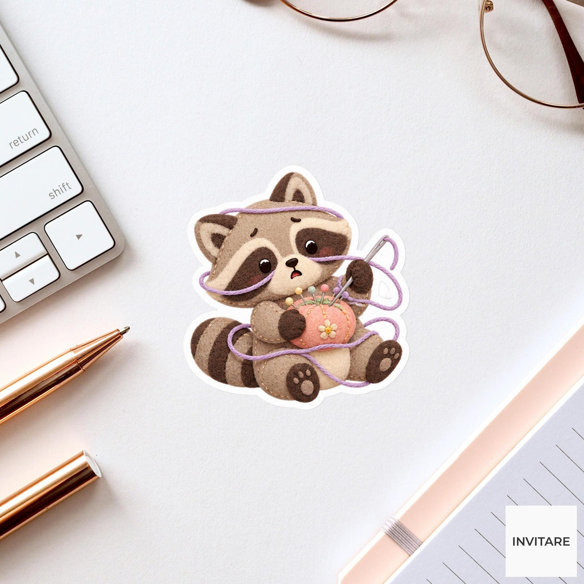 Raccoon caught in a soft thread loop while holding a needle cushion Vinyl Sticker