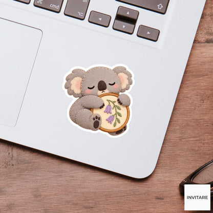Koala hugging a fabric hoop while slowly falling asleep Vinyl Sticker