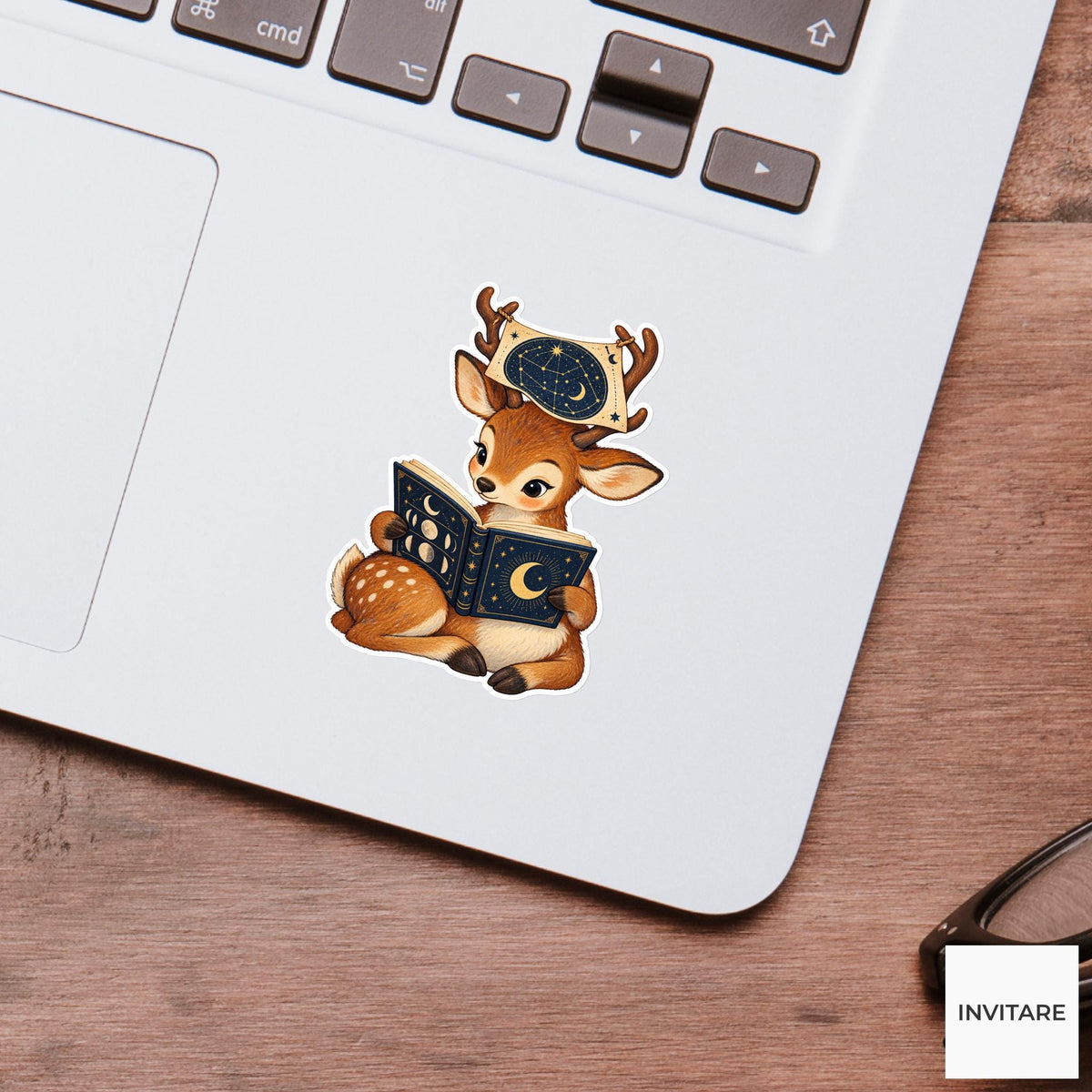 Deer holding a constellation map between its small antlers while reading the moon legend Vinyl Sticker
