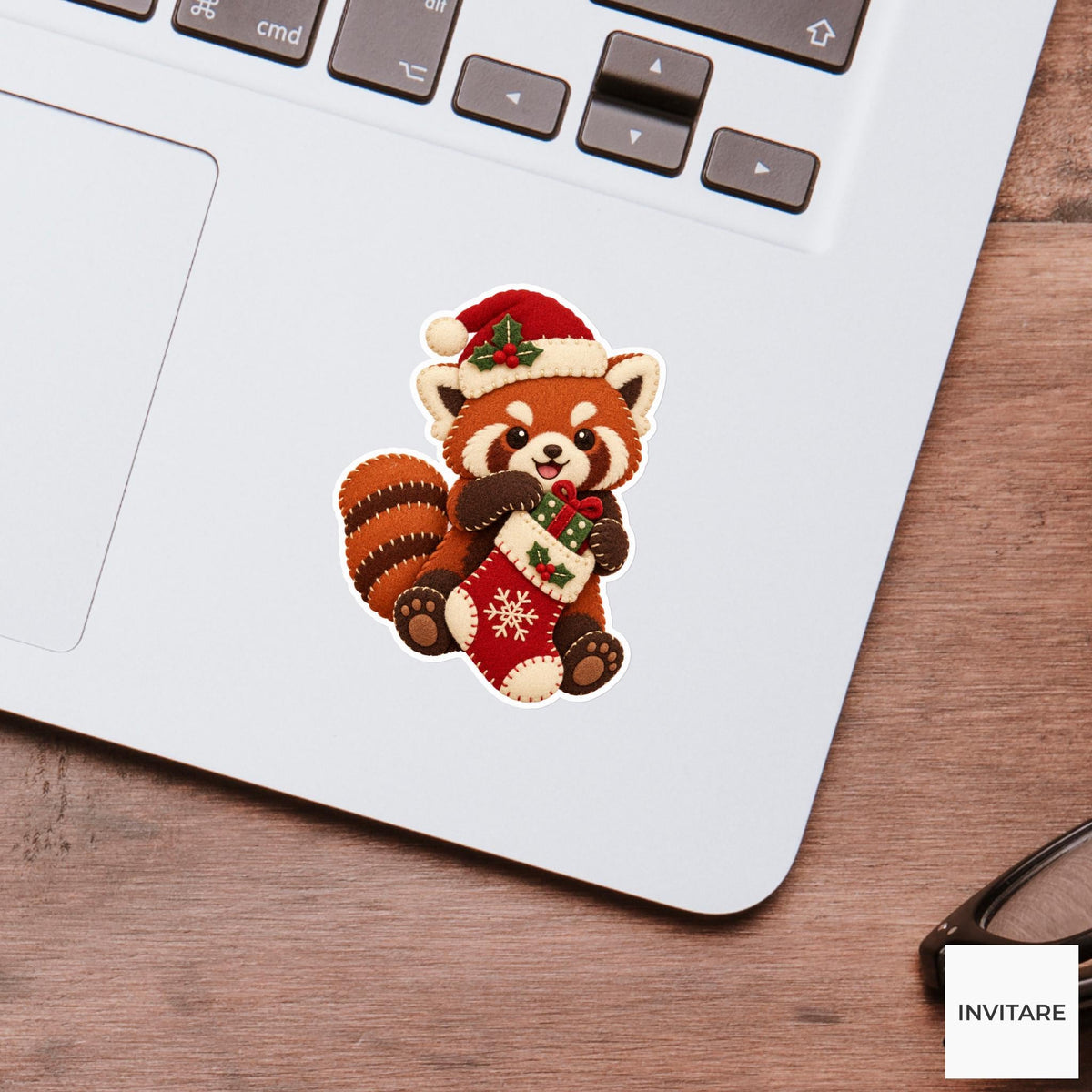 Red panda pulling a tiny wrapped gift out of its stocking with both paws Vinyl Sticker
