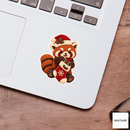 Red panda pulling a tiny wrapped gift out of its stocking with both paws Vinyl Sticker