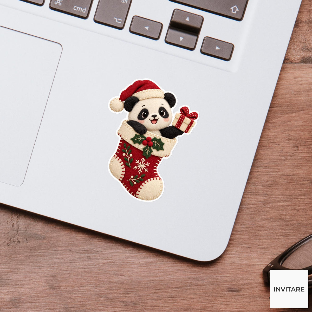 Panda popping out of a stocking and presenting a tiny cream gift box Vinyl Sticker