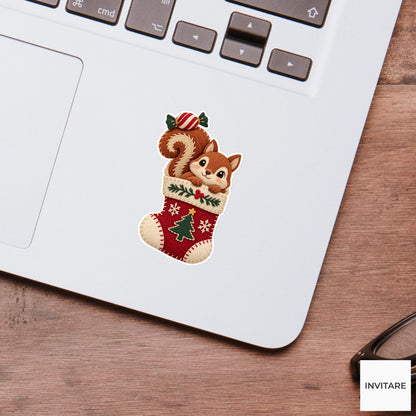 Squirrel hiding in a stocking with a wrapped sweet balanced on its curled tail Vinyl Sticker