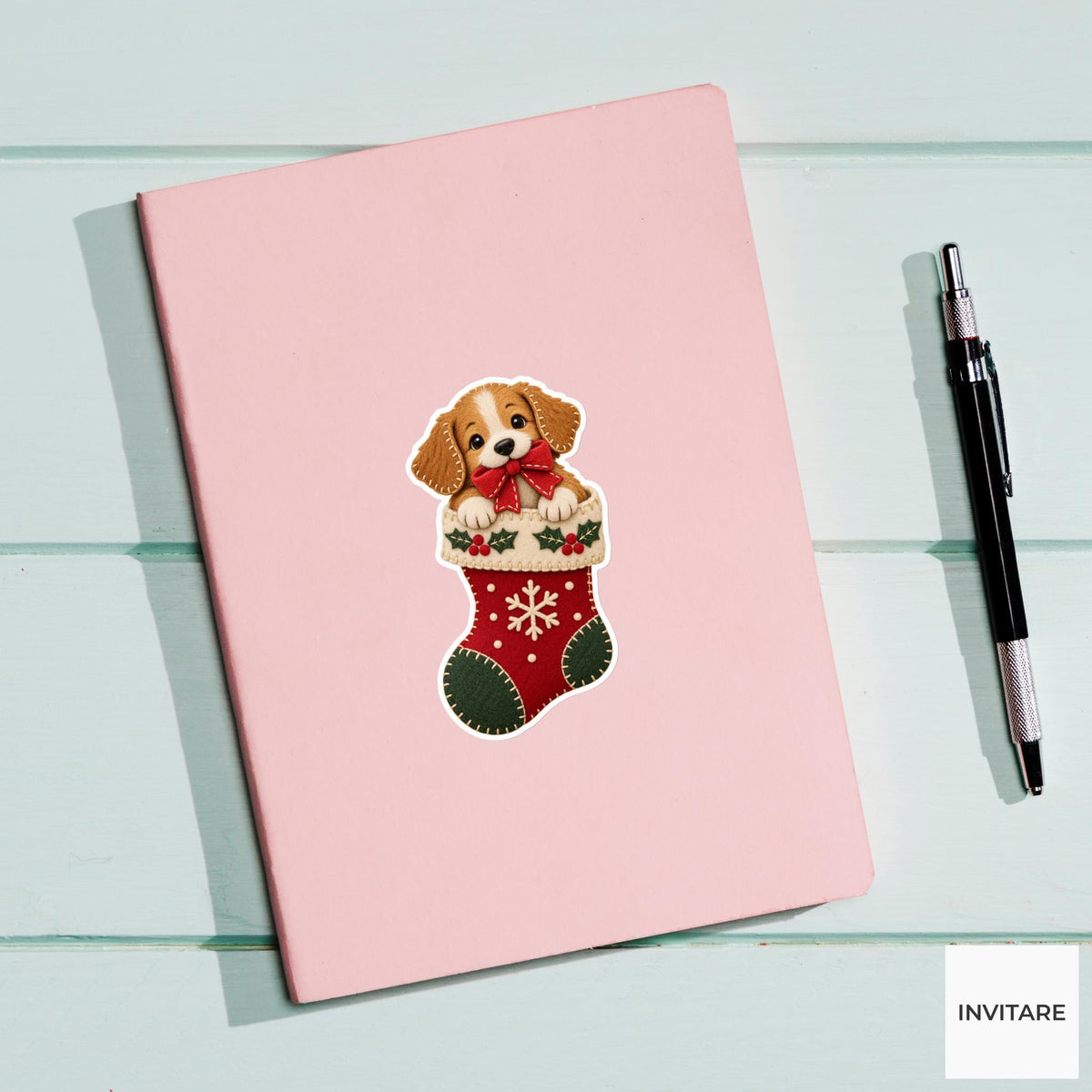 Dog peeking from a stocking while holding a red gift bow in its mouth Vinyl Sticker